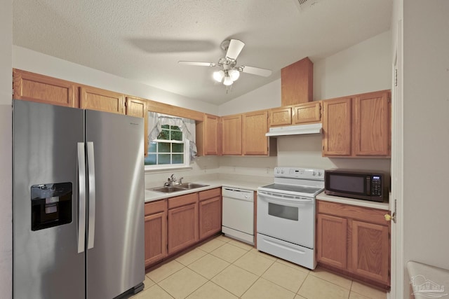 5362 Barbarosa Rd, Gulf Breeze, FL 32563 - kitchen featuring a sink, vaulted ceiling, white appliances, light countertops, and under cabinet range hood