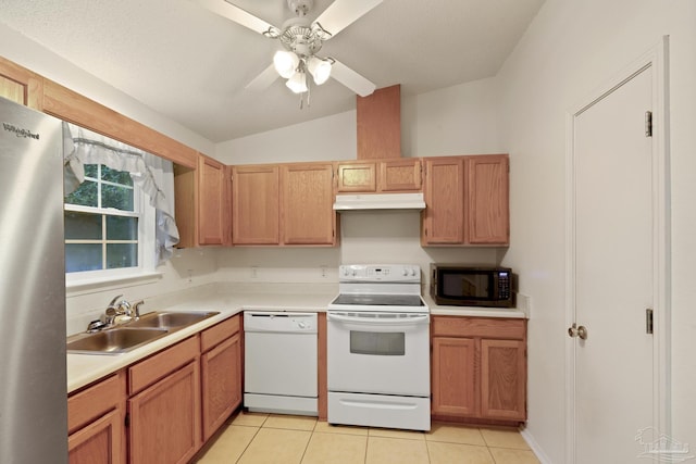 5362 Barbarosa Rd, Gulf Breeze, FL 32563 - kitchen with a sink, vaulted ceiling, white appliances, light countertops, and under cabinet range hood