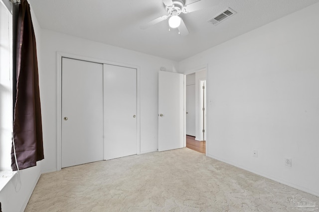 5362 Barbarosa Rd, Gulf Breeze, FL 32563 - unfurnished bedroom with ceiling fan, carpet flooring, visible vents, and a closet