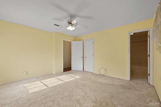 5362 Barbarosa Rd, Gulf Breeze, FL 32563 - unfurnished bedroom featuring carpet, visible vents, a ceiling fan, connected bathroom, and baseboards