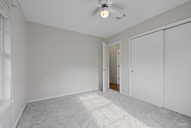 5362 Barbarosa Rd, Gulf Breeze, FL 32563 - unfurnished bedroom with a closet, ceiling fan, carpet, baseboards, and visible vents