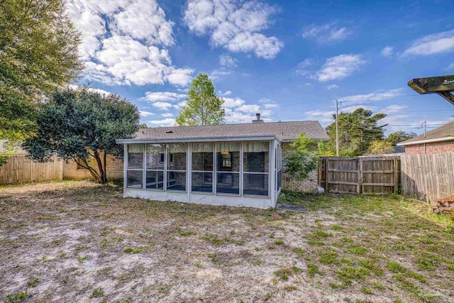 5362 Barbarosa Rd, Gulf Breeze, FL 32563 - back of property with a fenced backyard and a sunroom