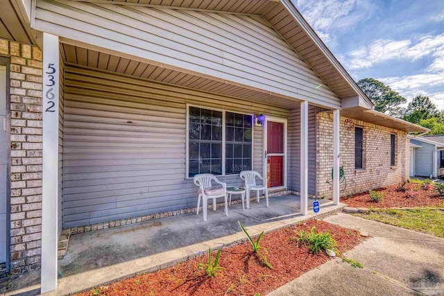 5362 Barbarosa Rd, Gulf Breeze, FL 32563 - property entrance featuring brick siding and a porch