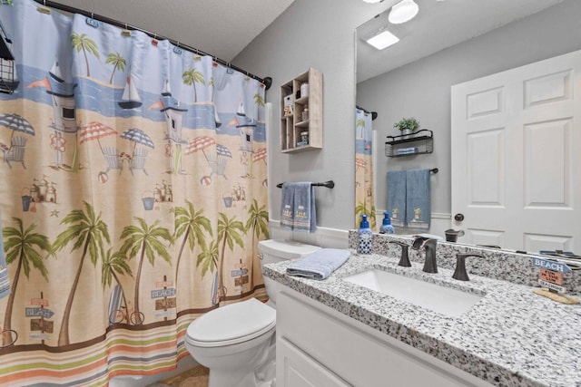 bathroom with vanity, toilet, and a shower with shower curtain