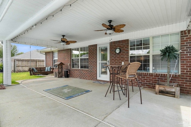 view of patio / terrace featuring a ceiling fan and fence