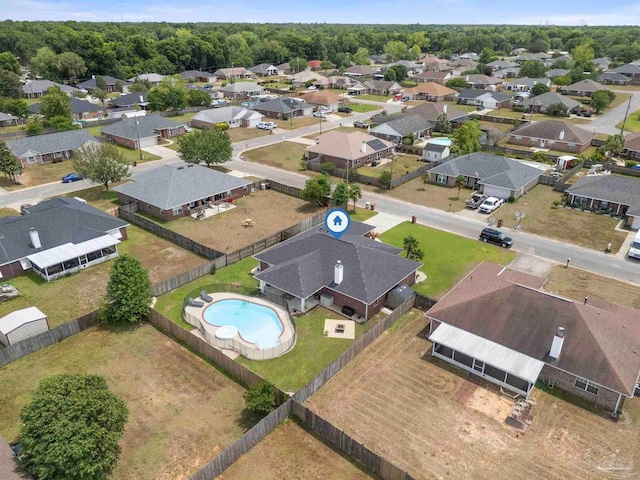 birds eye view of property with a residential view
