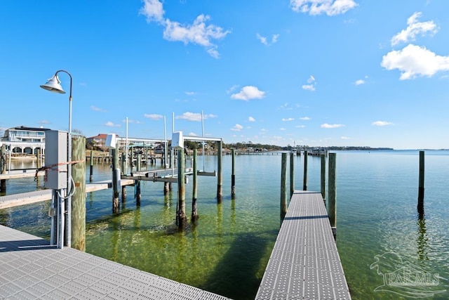 dock area with a water view and boat lift