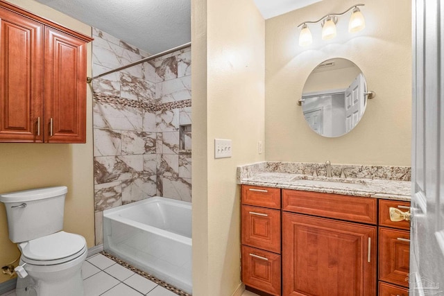 full bathroom with vanity, tile patterned flooring, tiled shower / bath combo, toilet, and a textured ceiling