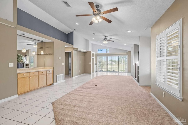 interior space featuring vaulted ceiling and a textured ceiling