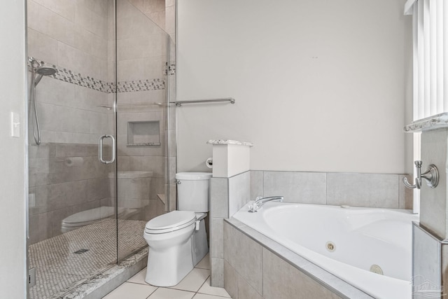 bathroom with tile patterned floors, separate shower and tub, and toilet