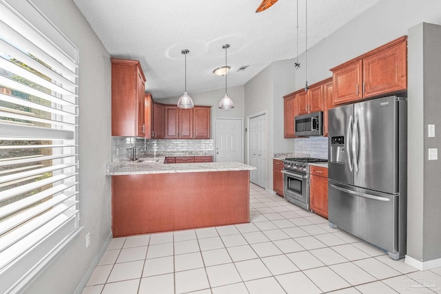 kitchen with kitchen peninsula, decorative backsplash, stainless steel appliances, and a textured ceiling