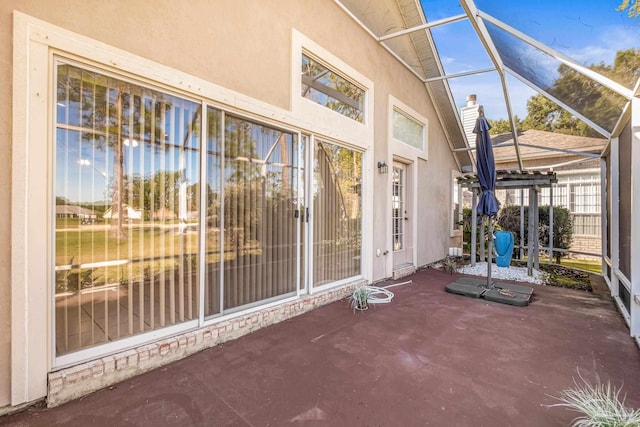 unfurnished sunroom featuring lofted ceiling