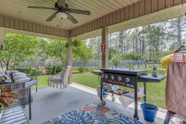 view of patio featuring a fenced backyard, ceiling fan, a playground, and outdoor lounge area