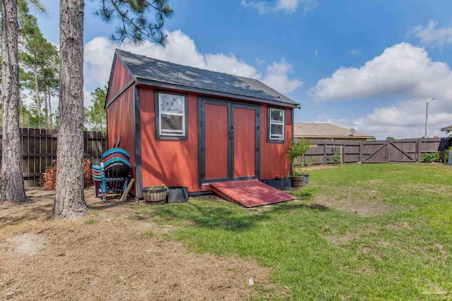 view of shed with a fenced backyard