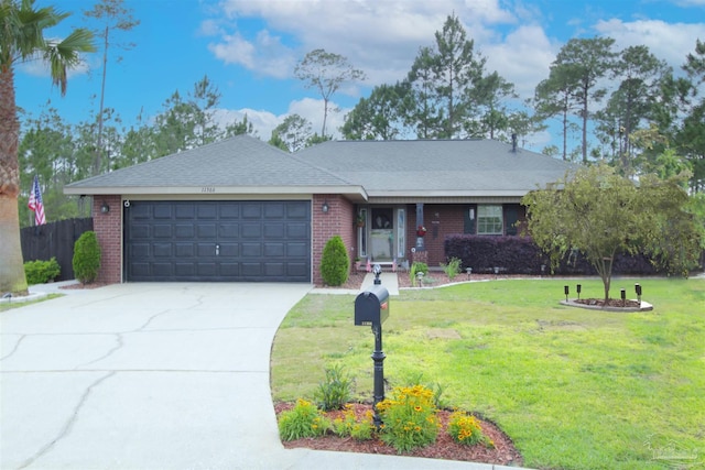 single story home featuring brick siding, an attached garage, driveway, and fence