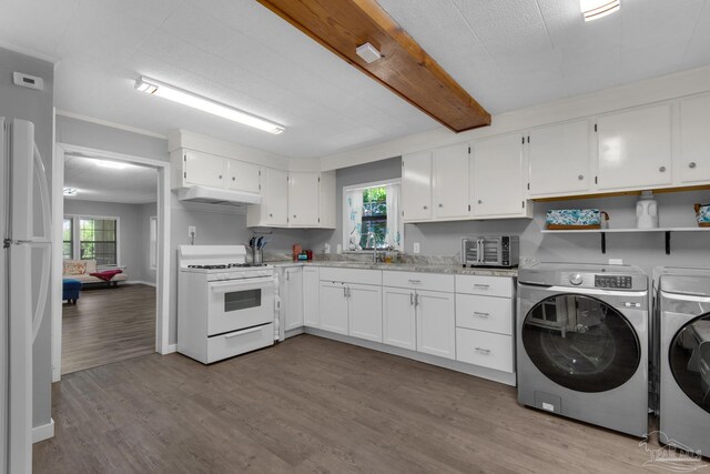 interior space featuring wall chimney range hood, light wood-type flooring, white cabinets, independent washer and dryer, and white appliances