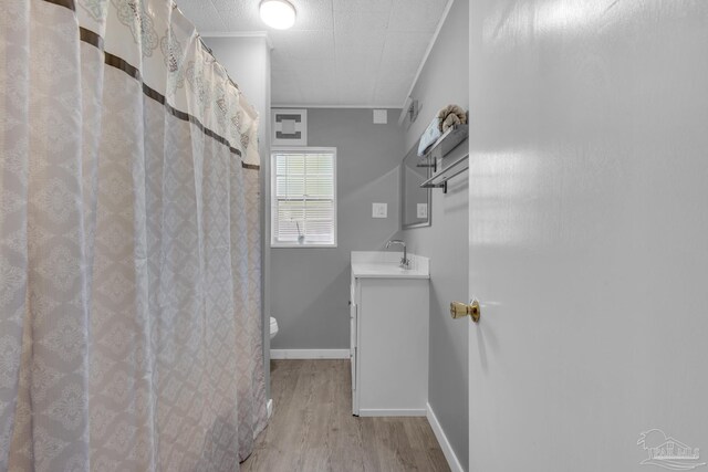 hall with sink and light hardwood / wood-style floors