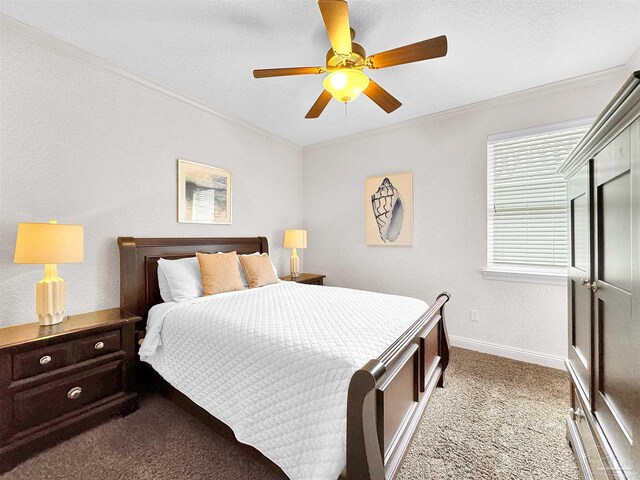 229 E Grand Key Loop, Destin, FL 32541 - carpeted bedroom with crown molding, ceiling fan, and a textured ceiling