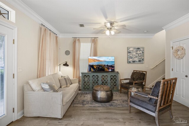 229 E Grand Key Loop, Destin, FL 32541 - living room with crown molding, ceiling fan, and hardwood / wood-style floors