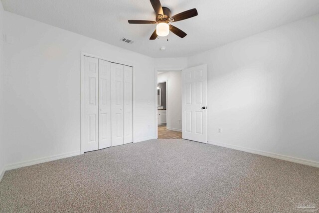 1042 Simpson St, Pensacola, FL 32526 - unfurnished bedroom with light carpet, baseboards, a closet, and ceiling fan