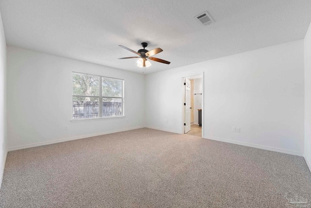 1042 Simpson St, Pensacola, FL 32526 - empty room with ceiling fan, light carpet, and baseboards