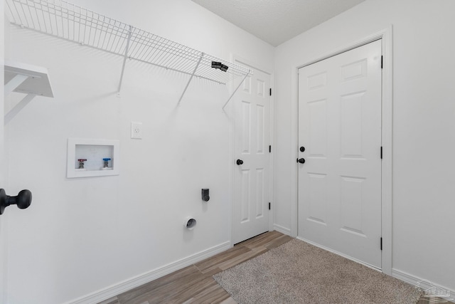 1042 Simpson St, Pensacola, FL 32526 - washroom featuring electric dryer hookup, wood finished floors, washer hookup, and baseboards