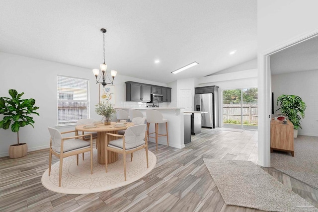 1042 Simpson St, Pensacola, FL 32526 - dining space featuring a chandelier, lofted ceiling, light wood-type flooring, baseboards, and recessed lighting