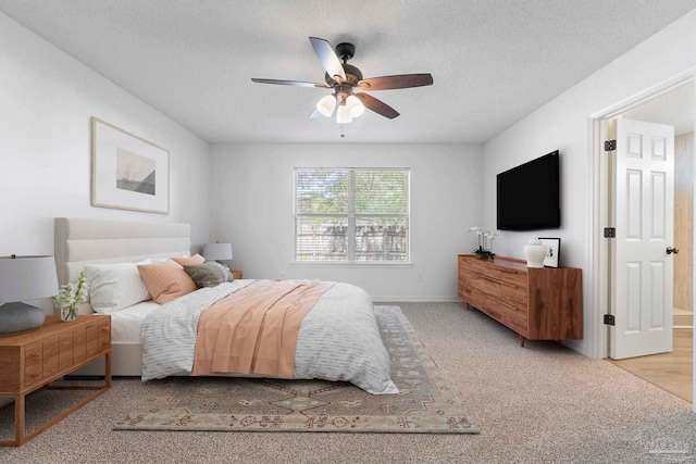 1042 Simpson St, Pensacola, FL 32526 - carpeted bedroom with a textured ceiling, a ceiling fan, and baseboards