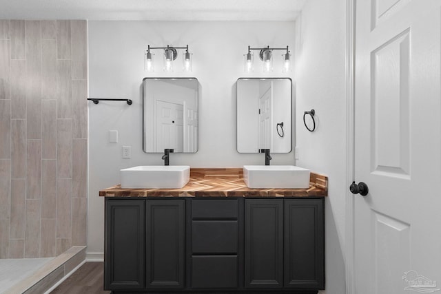 1042 Simpson St, Pensacola, FL 32526 - bathroom with double vanity and a tile shower