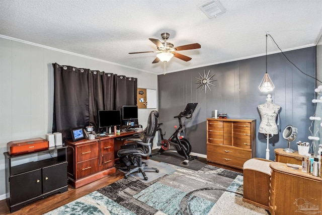 office area featuring crown molding, wood-type flooring, and a textured ceiling