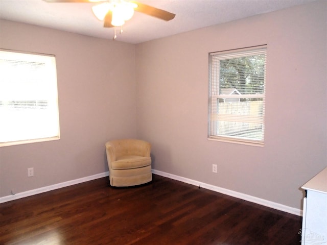 unfurnished room featuring dark hardwood / wood-style floors and ceiling fan