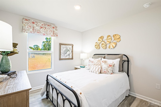 bedroom with wood-type flooring