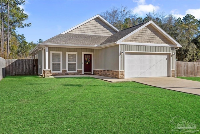 craftsman-style house featuring a front yard and a garage