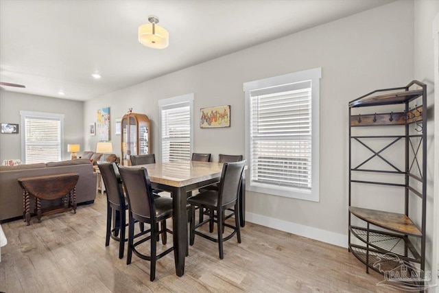 dining space with light wood-type flooring