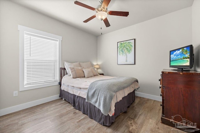 bedroom featuring ceiling fan and light wood-type flooring