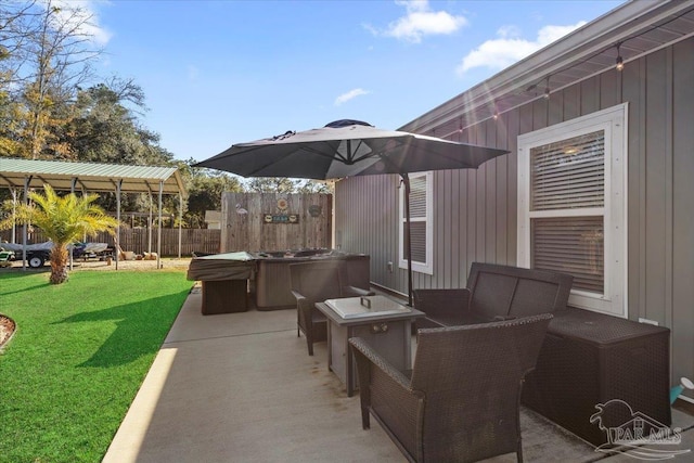 view of patio / terrace with a hot tub and outdoor lounge area