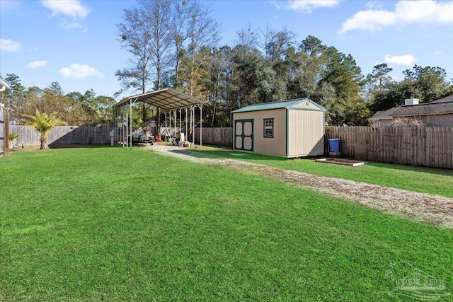 view of yard with a carport and a storage shed