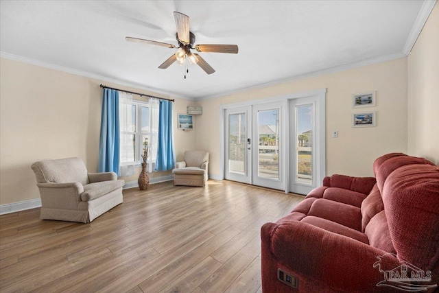 living room featuring light wood-type flooring, ceiling fan, and crown molding