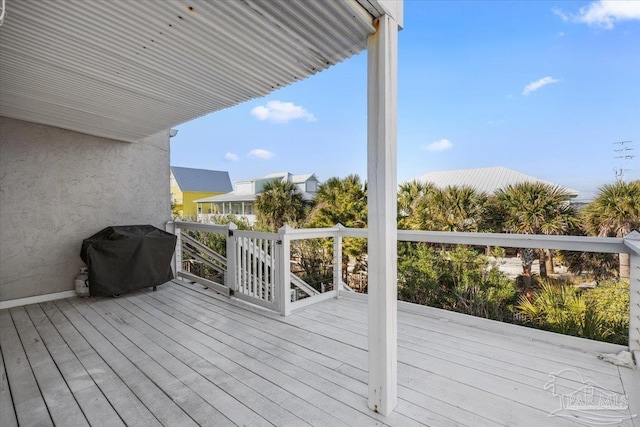 wooden terrace featuring grilling area