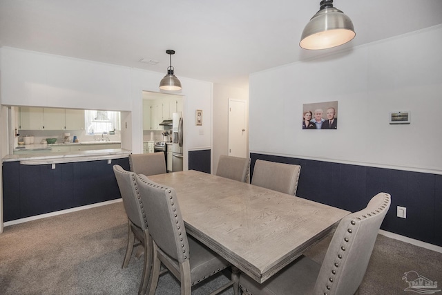 dining area featuring visible vents and dark carpet