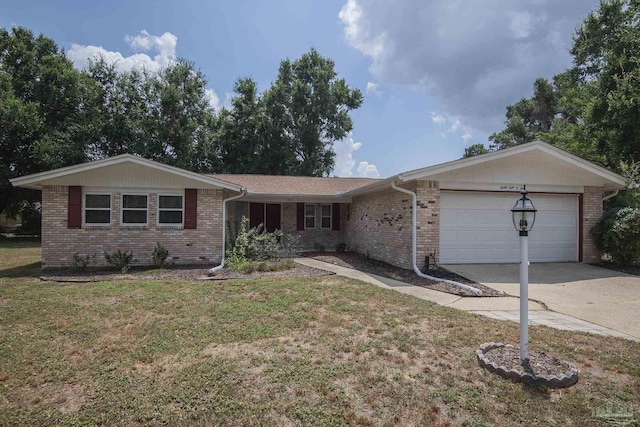 single story home featuring a garage, a front yard, concrete driveway, and brick siding