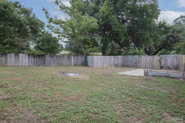 view of yard with a fenced backyard