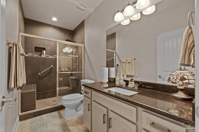 full bath with a shower stall, toilet, and vanity