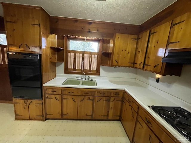 kitchen with black appliances, a sink, open shelves, extractor fan, and light floors