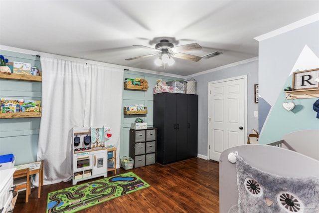 bedroom featuring crown molding, visible vents, a ceiling fan, and dark wood-type flooring