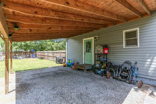 view of patio / terrace featuring a fenced backyard and a playground