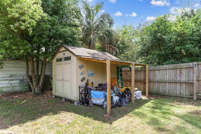 view of shed featuring a fenced backyard