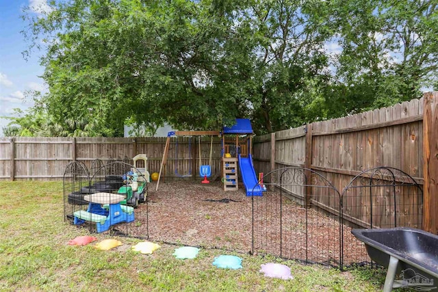 view of jungle gym with a fenced backyard