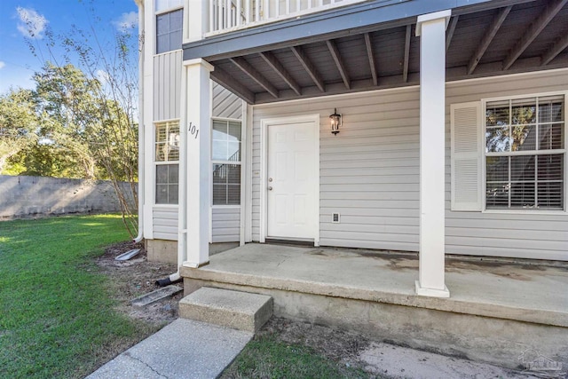 entrance to property with a yard