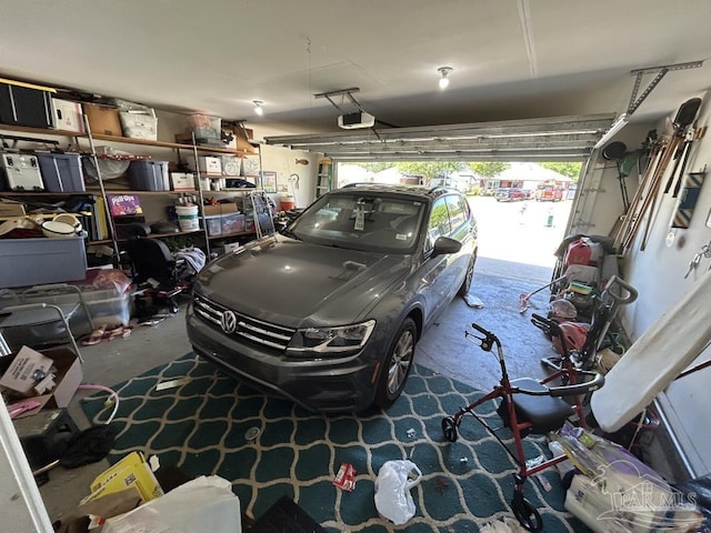 garage featuring a garage door opener